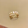 Close-up detail of a gold open ring featuring a heart zircon and delicate pearl. - Heart Starry Pearl Adjustable Ring / Gold