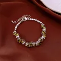 Charming silver bracelet with sparkling olive green gemstones and clear zirconia crystals - No 49 Green White Zirconia Style