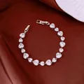 Elegant silver-toned bracelet featuring heart-shaped white crystals on brown satin cloth - No 60 Heart Splicing Pave Style