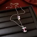 Detail view of cute bitten apple necklace with cat pendant and colorful beads - Silver-Blue-Pink