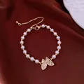 Elegant pearl bracelet with sparkling crystal butterfly charm and adjustable gold chain. - No 64 Butterfly Pearl Adjustable Style