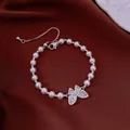 Elegant white pearl bracelet with sparkling crystal butterfly charm in silver finish - No 65 Silver Butterfly Pearl Style