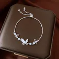 Elegant silver butterfly charm bracelet with blue pearls and sparkling crystals for women - No 66 Hollow Butterfly Pull Style