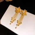 Detailed macro view of 18k gold plated flower earrings with zircon tassels and gold beads - 18K Gold Plated (Silver Needle) / Gold