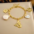 Élégant bracelet en acier inoxydable doré avec breloques sirène et coquillages marins - B2201 Bracelet