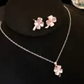 Detailed view of pink cat's eye clover necklace and stud earrings set for women - Necklace and Earrings Set / Pink
