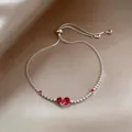 Elegant silver slider bracelet featuring a red heart zircon and shimmering crystals - Rose Red Heart