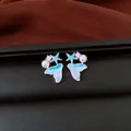 Detailed view of ocean-themed earrings featuring a blue mermaid tail and starfish. - Style 2 Fish Tail & Starfish