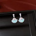 Close-up detail of light blue enamel shell earrings with pearls and zircon crystals - Style 1 Shell & Pearl