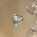 Detailed view of an open ring featuring a light blue starfish, a pearl, and a clear zircon - Starfish Pearl Shell Style (2nd Ring) / Silver Ring-Blue Enamel