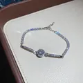 Detailed view of a vintage silver bracelet with sparkling round zircon and pave accents. - Silver White