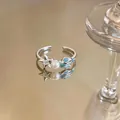 Close-up of open ring featuring a zircon starfish, pearl and blue enamel shell. - Starfish Pearl Shell Style (3rd Ring) / Silver Ring-Blue Enamel