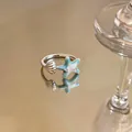 Close-up of a silver starfish and shell open ring with light blue enamel and zircons - Starfish Shell Style (1st Ring) / Silver Ring-Blue Enamel