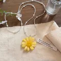 Handmade yellow daisy flower pendant necklace with elegant white pearls and clear beads - Yellow - Transparent