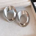 Minimalist geometric hollow oval stud earrings with a sleek silver metallic finish - Silver