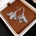 Macro view of silver scale-like sequin drop earrings with a purple pearl in a luxury box. - Geometric Sequin Pearl Pendant (HE34171) / Silver