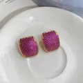 Macro view of elegant geometric earrings with magenta zircon pavé in a gold-tone setting - Geometric Rectangular Style (HE33656) / Pink