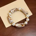 Vintage acrylic leopard pattern bracelet with pearls and gold accents - White Marble Pattern