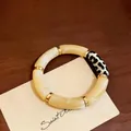 Retro acrylic leopard print splice bracelet featuring cream-colored beads and gold accents - Beige Patchwork Leopard Print
