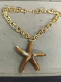 Chunky gold chain necklace with amber acrylic starfish pendant for holiday style. - Starfish / Brown