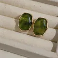 Macro shot of green resin earrings with elegant gold irregular edges in a jewelry box - Irregular Oval Style (HE32484) / Gold with Green