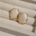 Detail shot of elegant Maillard style resin oval earrings with gold wrinkled edges - Irregular Oval Style (HE32484) / Gold with White