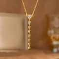 Detailed close-up view of an elegant gold heart Y-shaped tassel necklace with clear zirconia - Heart White Zirconia Long Style (9493) / Gold