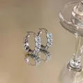 Detailed view of silver hoop earrings with marquise zircon wheat ear patterns - Ear Buckle / Silver-White