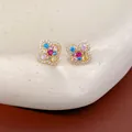 Detail view of colorful zircon clover flower stud earrings featuring elegant 14k gold plating - Silver Earring Post Real Gold Plated / Gold-Multicolor