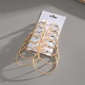 Detailed view of 6-pair set gold-plated hoop earrings in various sizes on display card - 6 Pairs Set / Gold
