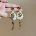 Vintage marble shell earrings with gold horse and horn charms for beach vacation - Gold Brown