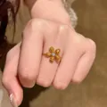 Luxury vintage gold flower chain ring with yellow pavé crystals and a clear center stone - Yellow