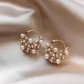Macro detail of French vintage gold hoop earrings adorned with pearls and clear crystals - Hollow Cluster Pearl (Coffee Decoration) / Gold