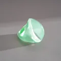 Close-up detail of a chunky mint green resin fan ring showing pearlescent texture and shape - Fan Shape Style / Green