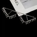 Close-up of W-shaped decorative silver glasses frame with dangling rhinestone tassels detail. - Type 4 - Silver