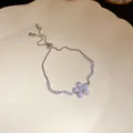 Macro view of silver flower bracelet with sparkling zircon stones and adjustable clasp - Silver