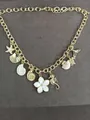 Gold chain necklace featuring assorted ocean shell, starfish and white flower pendants - Necklace (HN12391) / Gold-White