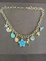 Gold ocean-themed charm necklace with blue enamel flowers and sea animals - Necklace (HN12391) / Gold-Blue