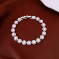Detailed view of elegant silver-plated bracelet featuring round cubic zirconia stones - White Zirconia (Gold Plated) / Silver