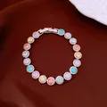 Detailed view of gold-plated zircon bracelet with vibrant multi-colored round stones - Multicolor Zirconia (Gold Plated) / Silver