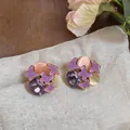 Detail view of sweet forest style purple butterfly enamel earrings with faceted gemstones - Silver Needle / Purple