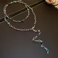 Top view of a double-layered necklace featuring vibrant colorful acrylic glass beads. - Silver