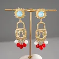Vintage gold padlock tassel earrings with red beads and blue sunburst stud details. - Silver Post Lock Tassel Style / Gold with Red and Blue Pendants