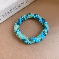 Bracelet bohème fait main en perles de cristal bleues et vertes au design tissé. - Bracelet / Bleu-Vert