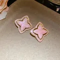 Detailed close-up of pink dripping oil star-flower earrings with vintage gold border - Silver Post Style (HE33380) / Pink