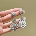 Close-up of elegant vintage style chandelier earrings with pearls and zircons - 银针(HE33556) / Silver
