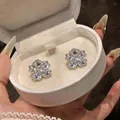 Detailed view of exquisite 18K gold plated zircon flower-shaped clip-on earrings - Clip-On Earrings / Silver
