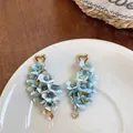 Exquisite light blue fabric flower earrings with golden heart studs and crystal tassels - Blue