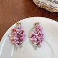 Handmade pink fabric flower drop earrings with gold heart studs and crystal tassels - Purple