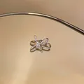 Detailed view of a sparkling zircon-encrusted silver bow-shaped clip-on ear cuff - Bowknot Style (13#)